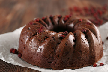 Chocolate cake on paper, closeup