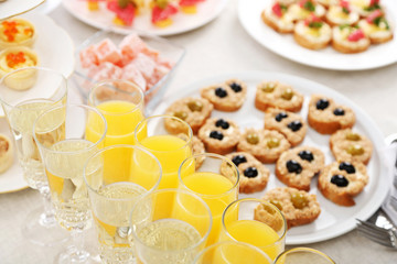 Set of cold snacks, canape, beverages, closeup