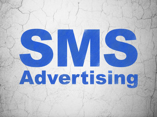 Marketing concept: SMS Advertising on wall background
