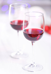 Wineglasses on blurred lights background