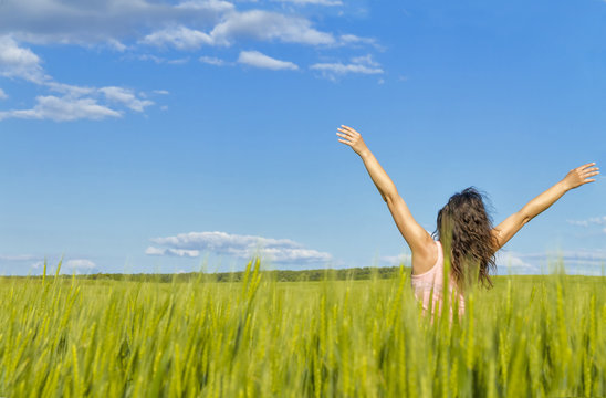 Young Woman In Green Field