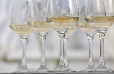 Glasses of white wine on table closeup