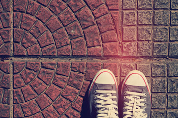 Top view of shoes on street, selfie, travel concept.