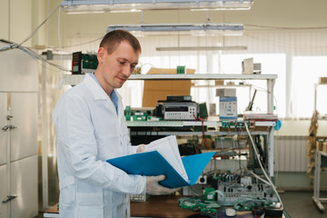 Microchip production factory. Computer expert
