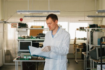 Microchip production factory. Computer expert
