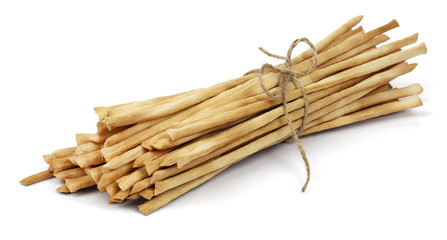 Crispy crunchy long bread sticks tied with rope, isolated on a white background.