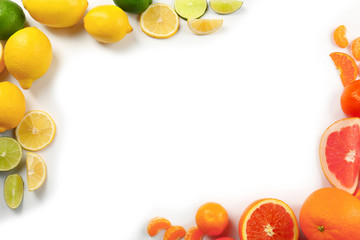 Fresh mixed citrus fruit including   lemons, limes, grapefruits, oranges and  tangerines isolated on white background, top view