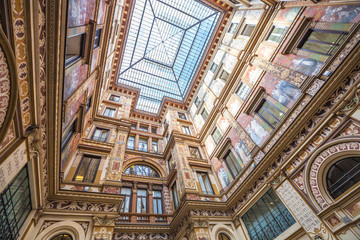 Detail of the famous glass roof Galleria Alberto Sordi, the oldest shopping center, located in Piazza Colonna in Rome, Italy. - obrazy, fototapety, plakaty