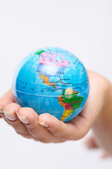 woman's hand with globe