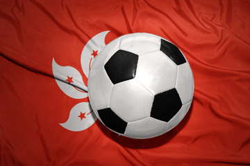 black and white football ball on the national flag of hong kong