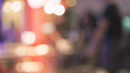 Blurred defocused of light in pub city abstract background