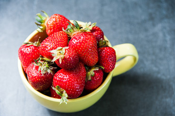 Color detail strawberries still life on stone table. 