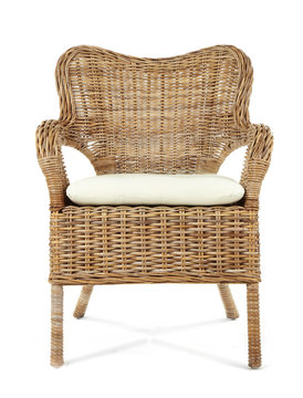 Comfortable wicker chair isolated on white