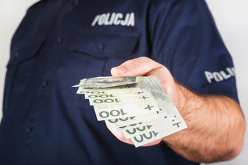 The policeman taking bribe