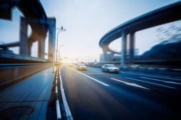 Fototapeta premium motion traffic on highway wity city background，chongqing china.