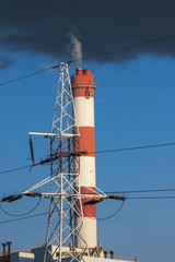 Power plant. Chimney and high voltage lines