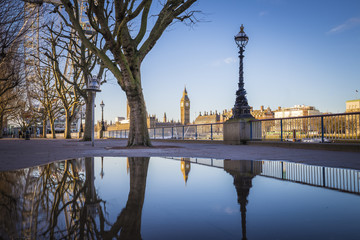 Reflections of the The Big Ben and Houses of Parliament taken from South Bank of River Thames early...