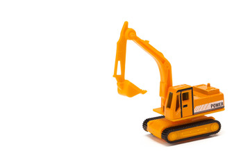 miniature construction vehicle on white background