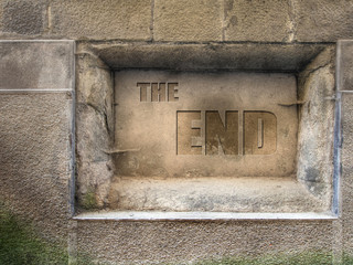 Plaque in old wall. The End.