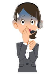 ヘッドセットを装着してスーツを着た女性が青ざめる
