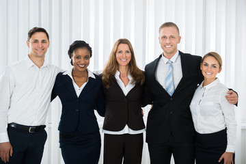 Businesspeople Standing In Office