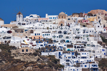 Fototapeta na wymiar Panoramic view to Oia town from the sea, Santorini island, Cyclades, Greece