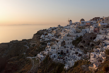 Last rays of sun in town of Oia, Santorini island, Thira, Cyclades, Greece