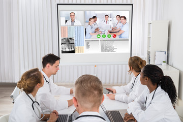 Fototapeta premium Doctors Videoconferencing With Male Doctor
