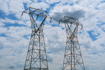 Electricity power station at a sunset.  High-voltage support. clouds in the sky - scale power plant danger. power plant at sunset. electrics
