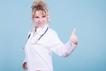 Female doctor showing thumb up.