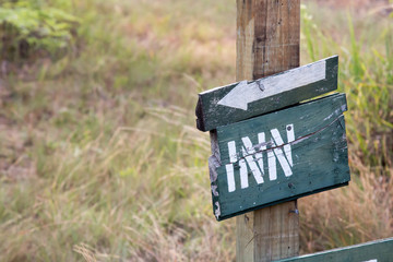 Sign and arrow to the Inn