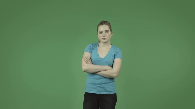 attractive upset caucasian casual girl isolated on green