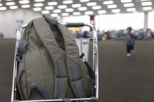 rucksack on cart in airport terminal building