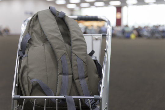 rucksack on cart in airport terminal building