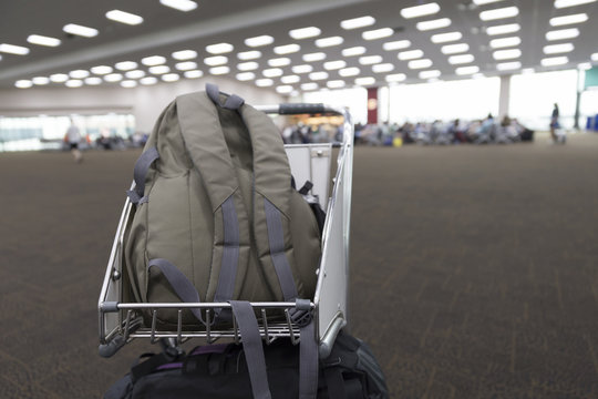 rucksack on cart in airport terminal building