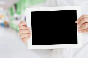 doctor hold digital tablet with blur hospital background