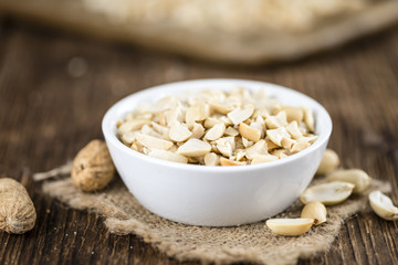 Some chopped Peanuts (close-up shot; selective focus)