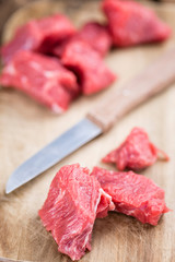 Beef Fillet (chopped) on wooden background