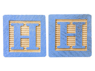 playing cubes with alphabets h.