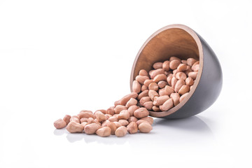 peeled peanuts a cup, isolated,