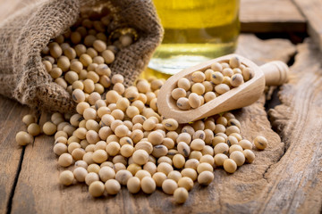 closeup is some soybeans with wooden spoon