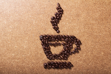 Picture a cup of coffee made from beans on the board.