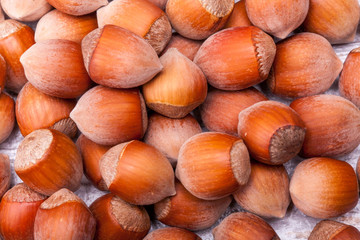 Nuts on wooden background in close up photo
