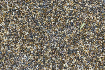 Many color round stone on the ground.