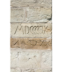 Stone wall textures. Medieval buttress detail with Roman numerals.