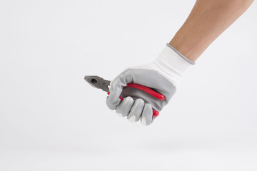 hand wear a glove holding pliers isolated on white background.