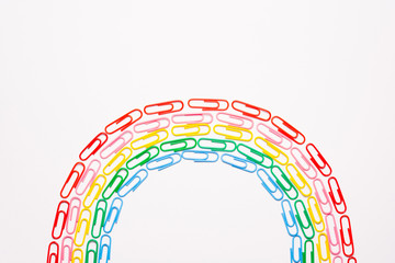 Colorful paperclips on white background