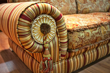 Detail of classic furniture sofa in living room.