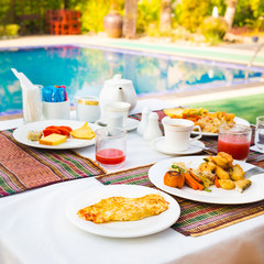 Breakfast near a swimming pool