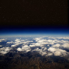 Fototapeta na wymiar Aerial view of Earth in space with stars. The desert in the western United States.